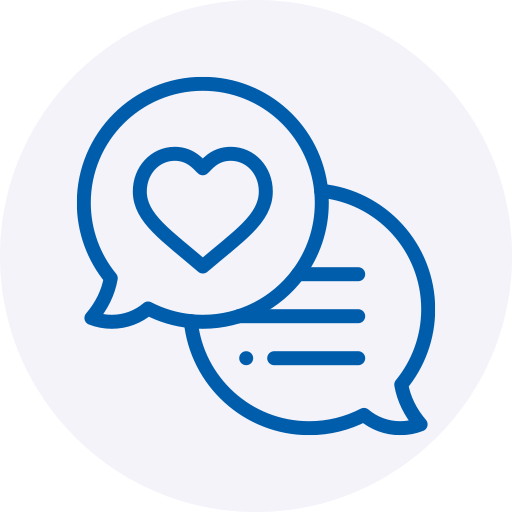 A blue line-art icon showing two overlapping speech bubbles centered against a soft, light grey circular background. The front speech bubble contains a heart symbol, while the bubble behind it features horizontal lines representing text.