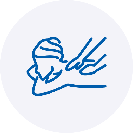 A blue line-art icon depicting a person lying face down and receiving a back or shoulder massage. The minimalist illustration is set against a soft, light grey circular background.