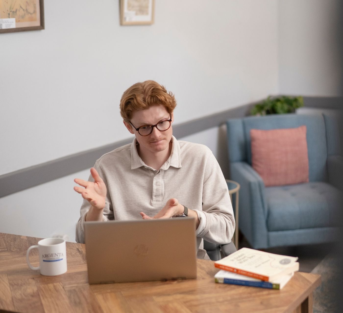 Therapy room with an “In Session – Please Do Not Disturb” sign hanging on the door, while a counseling session takes place inside. The image highlights a private, welcoming environment designed to support meaningful conversations and client confidentiality.